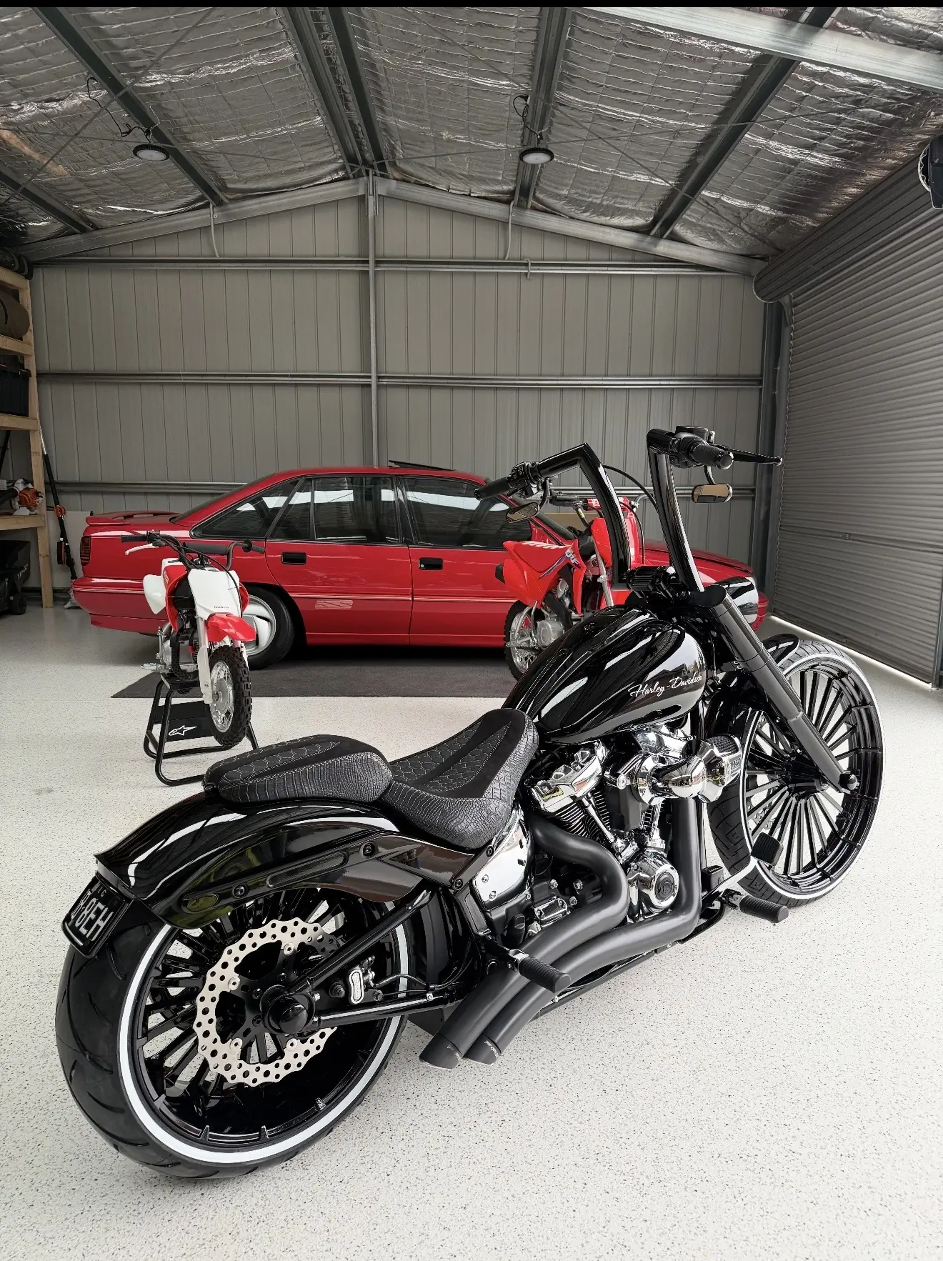 Black custom Harley-Davidson photographed in the workshop