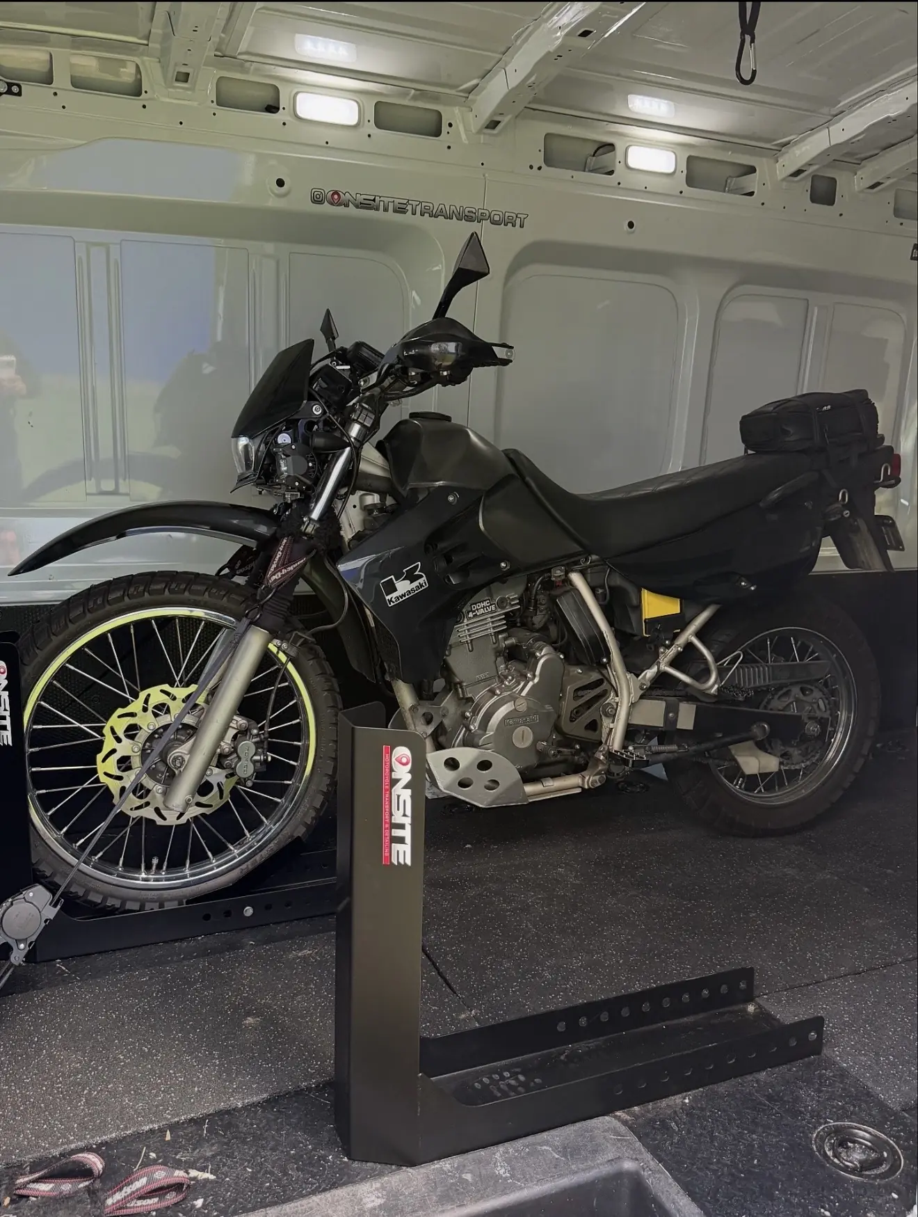 Adventure motorcycle secured inside the Onsite enclosed transport van