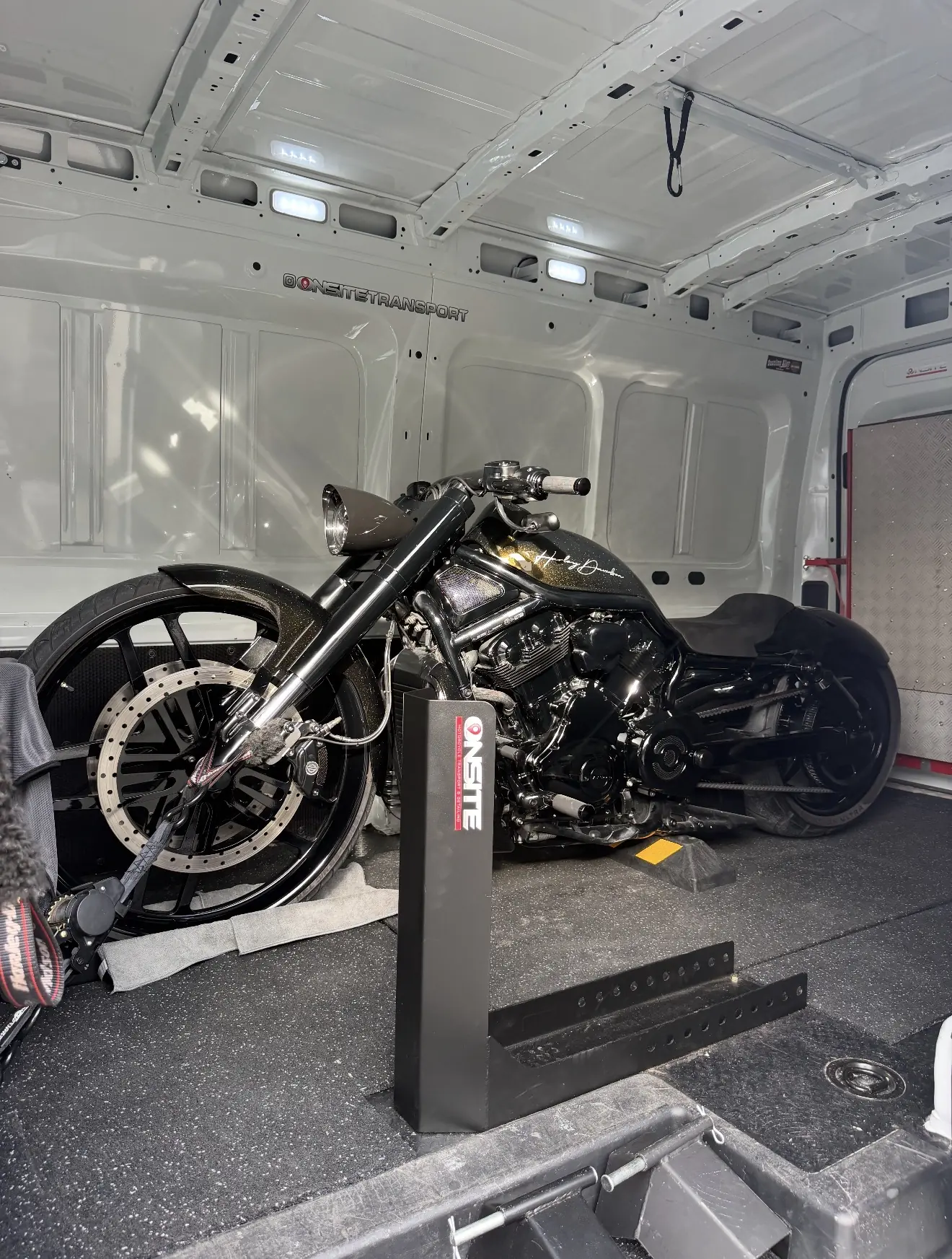 Custom black motorcycle prepared for enclosed transport