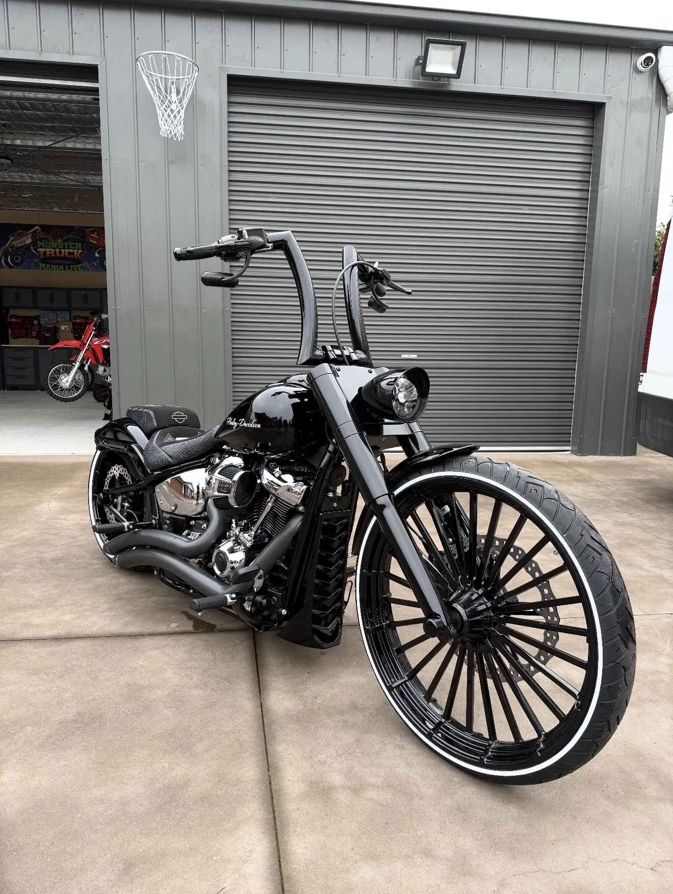 Custom black motorcycle photographed at the workshop
