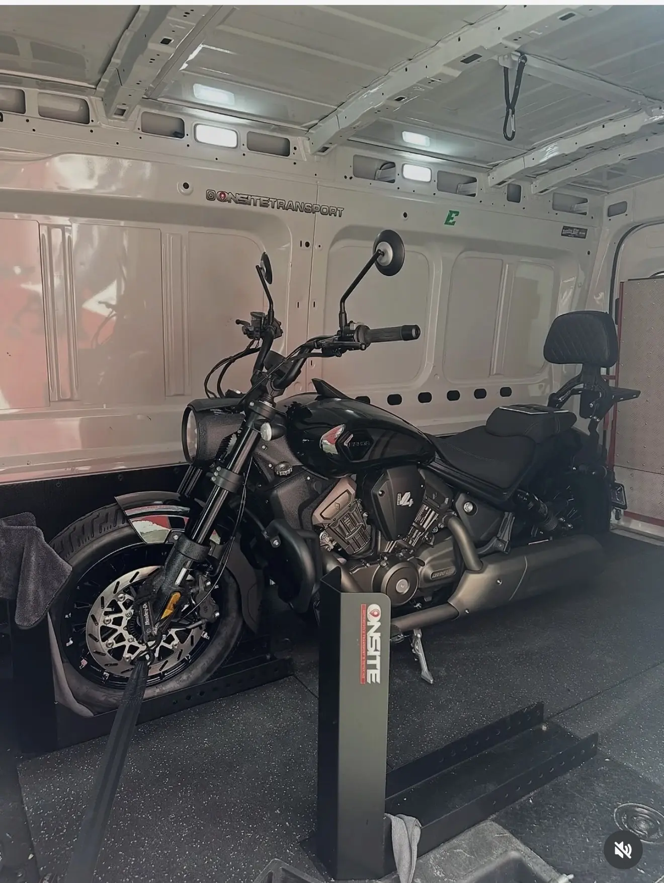 Black cruiser motorcycle secured in the Onsite transport system