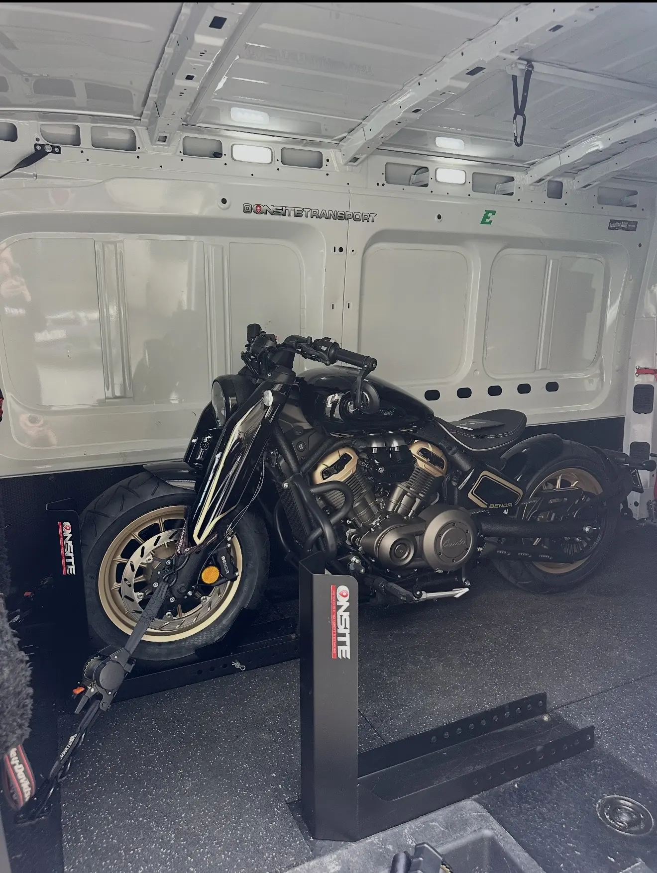 Black performance motorcycle prepared for enclosed transport