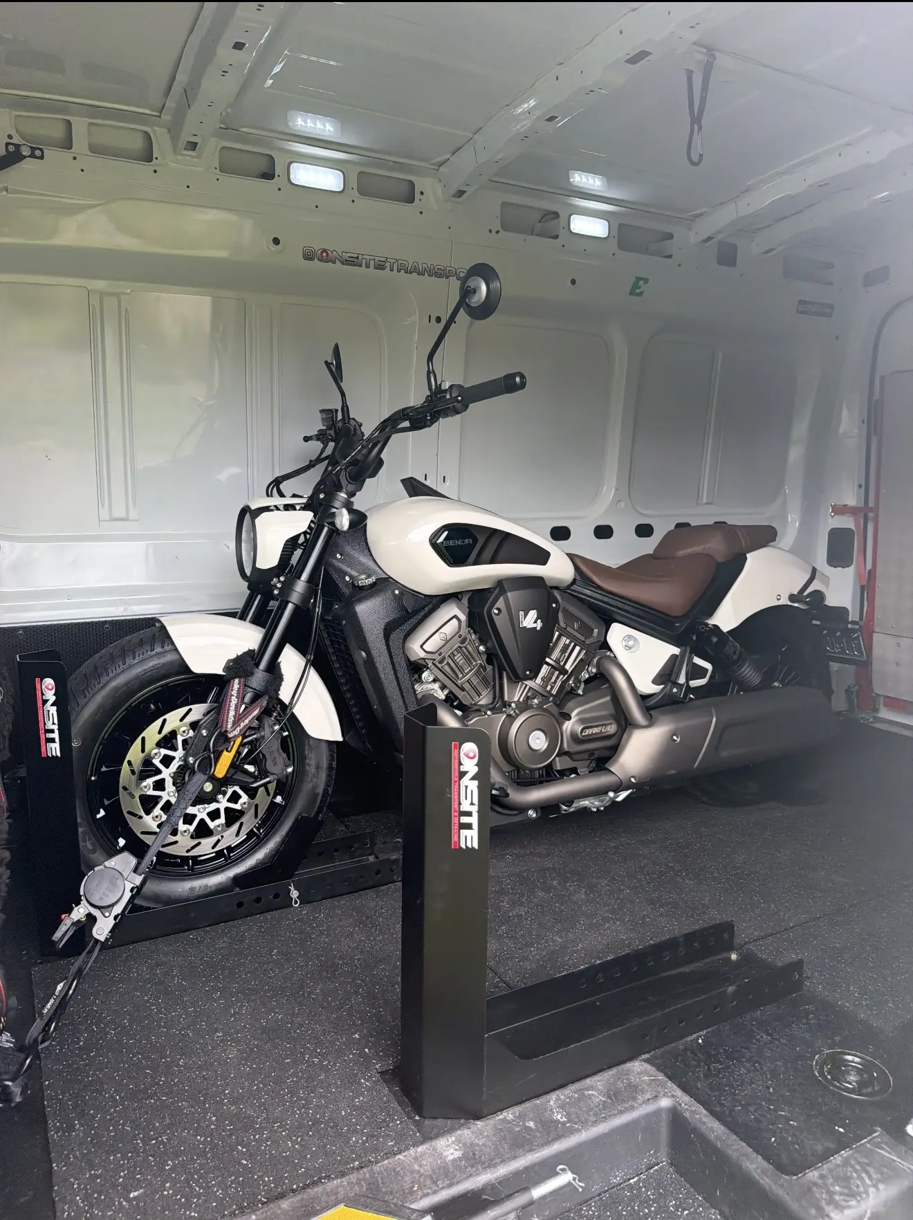 White custom motorcycle safely secured for transport